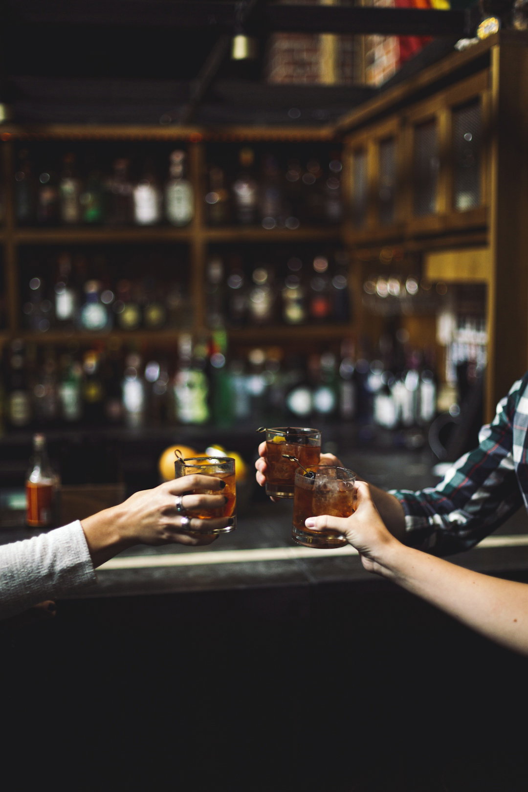 three-person-holding-clear-drinking-glasses.jpg three person holding clear drinking glasses